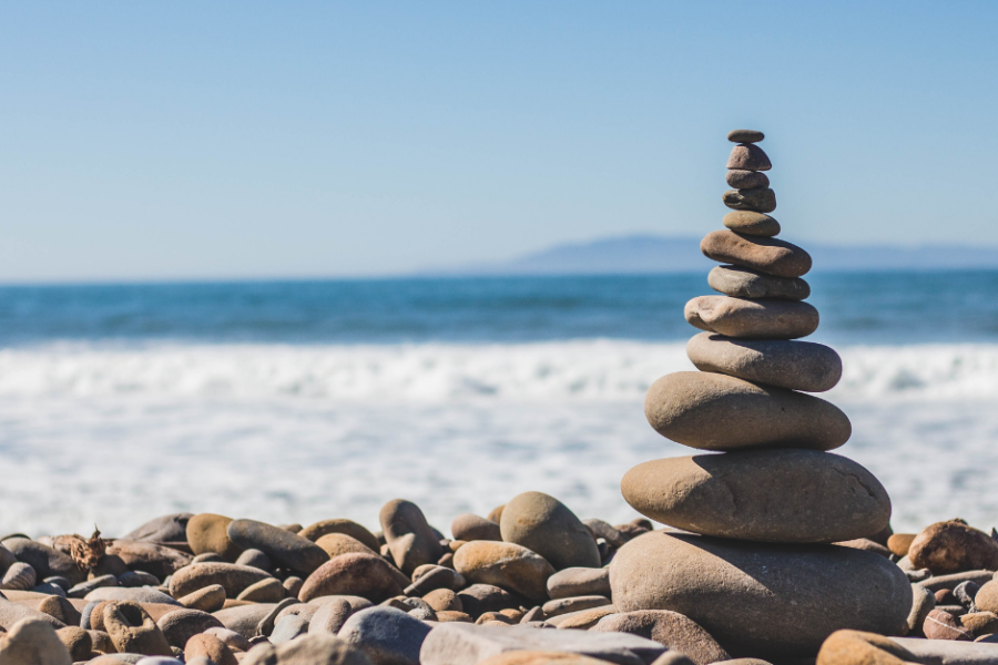 balancing stones on the beach
