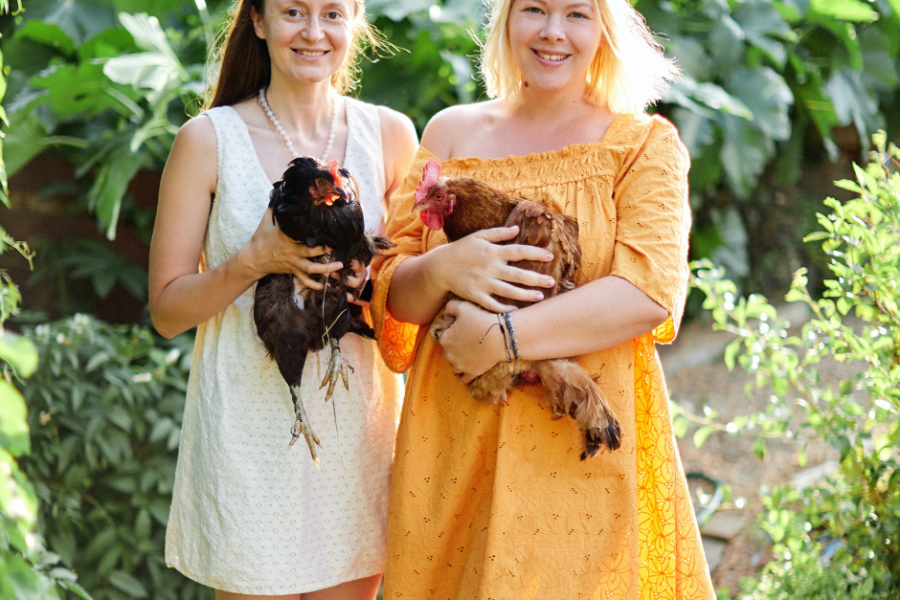 women farmers caring for chickens