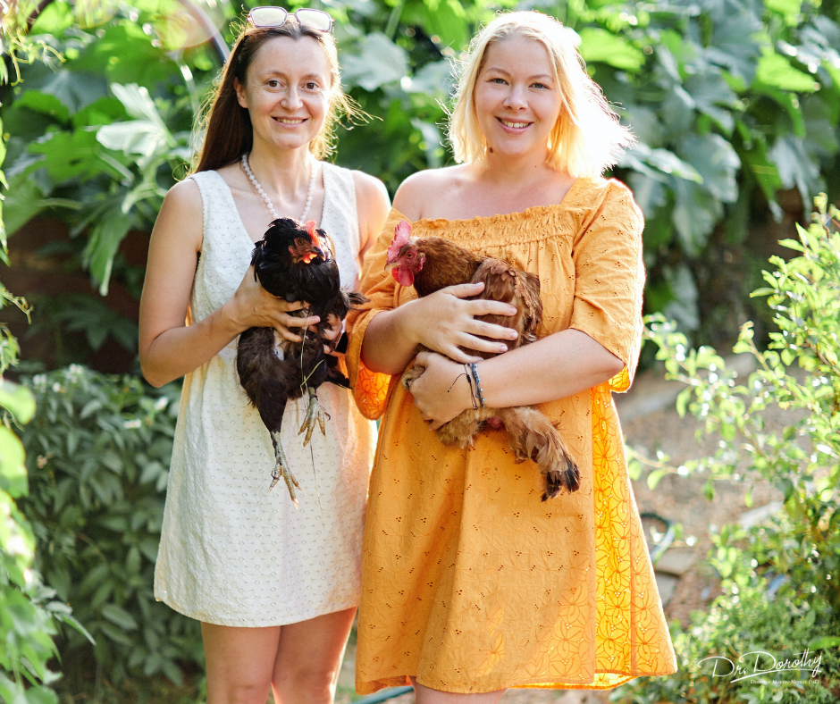 women farmers caring for chickens