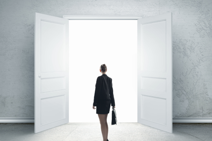 woman walking through the door of success