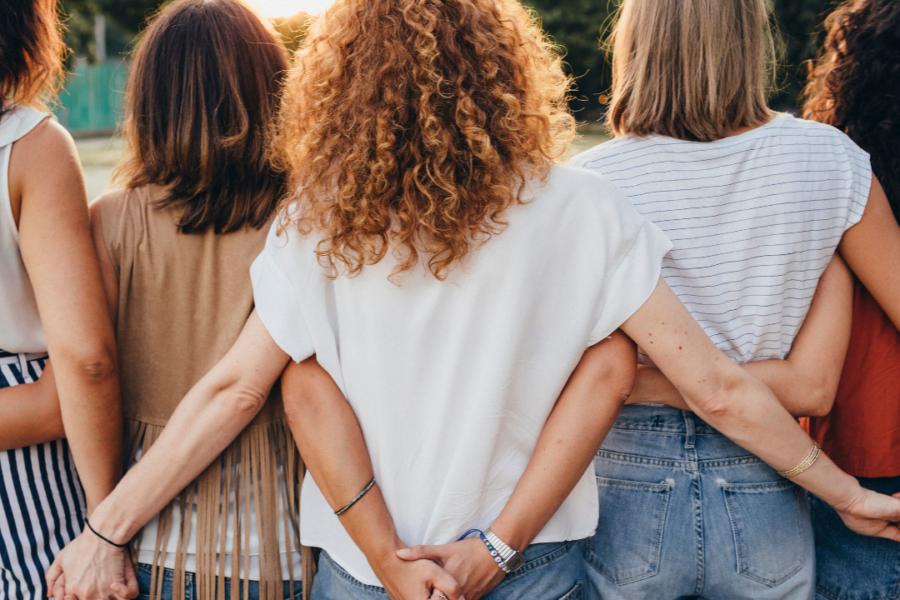 group of women friends supporting each other