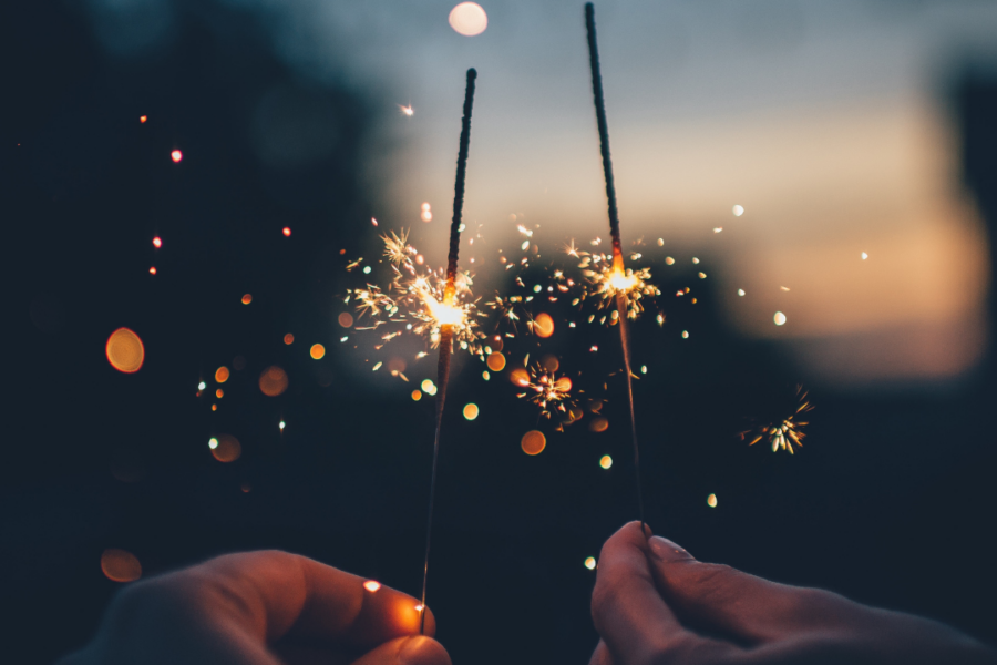 Two people doing fireworks on the 4th of July