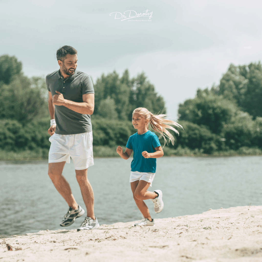 A farther running on the beach with his daughter