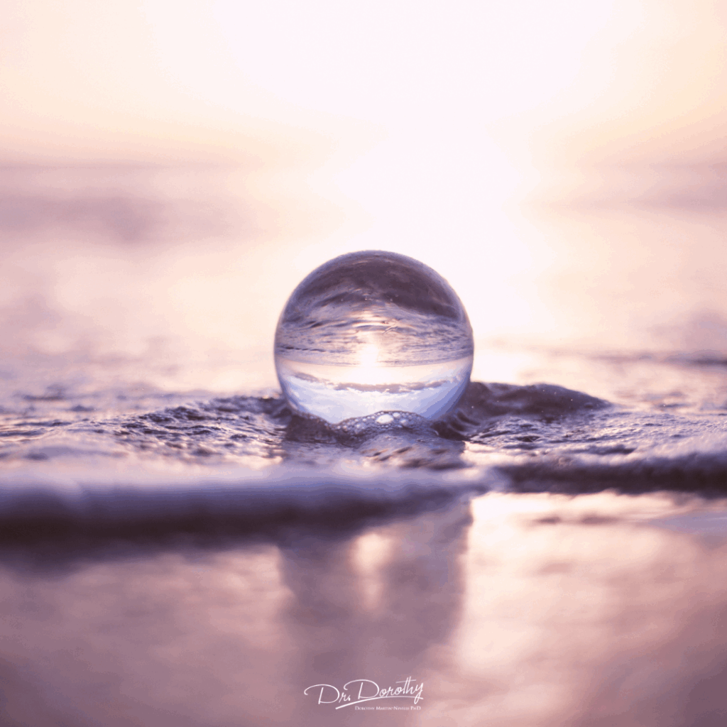 A glass marble in the water changing the direction of the water